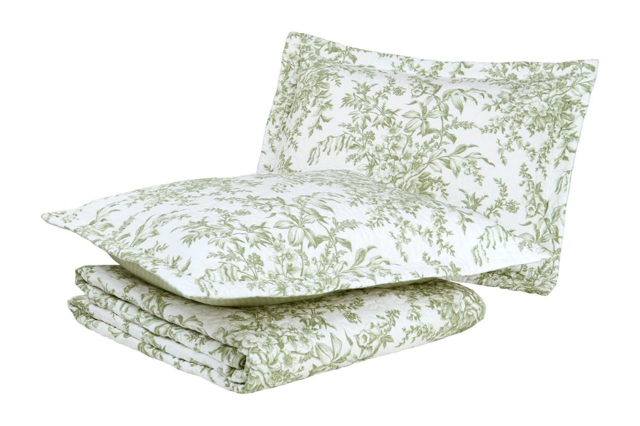 Bedding set including a quilt and pillow with a green leafy pattern Credit: Amazon