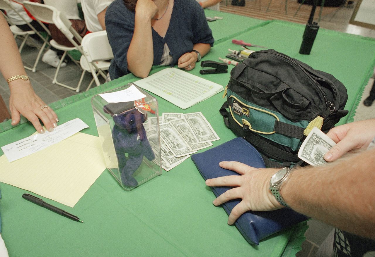 A successful bidder pays two hundred dollars for a Princess Beanie Baby, honoring Princess Diana, during a Beanie Baby auction at a mall in Cerritos, Calif., Thursday, July 23, 1998. A successful bidder pays $200 for a Princess Beanie Baby at a mall in Cerritos, Calif., on July 23, 1998Credit: AP Photo/John Hayes