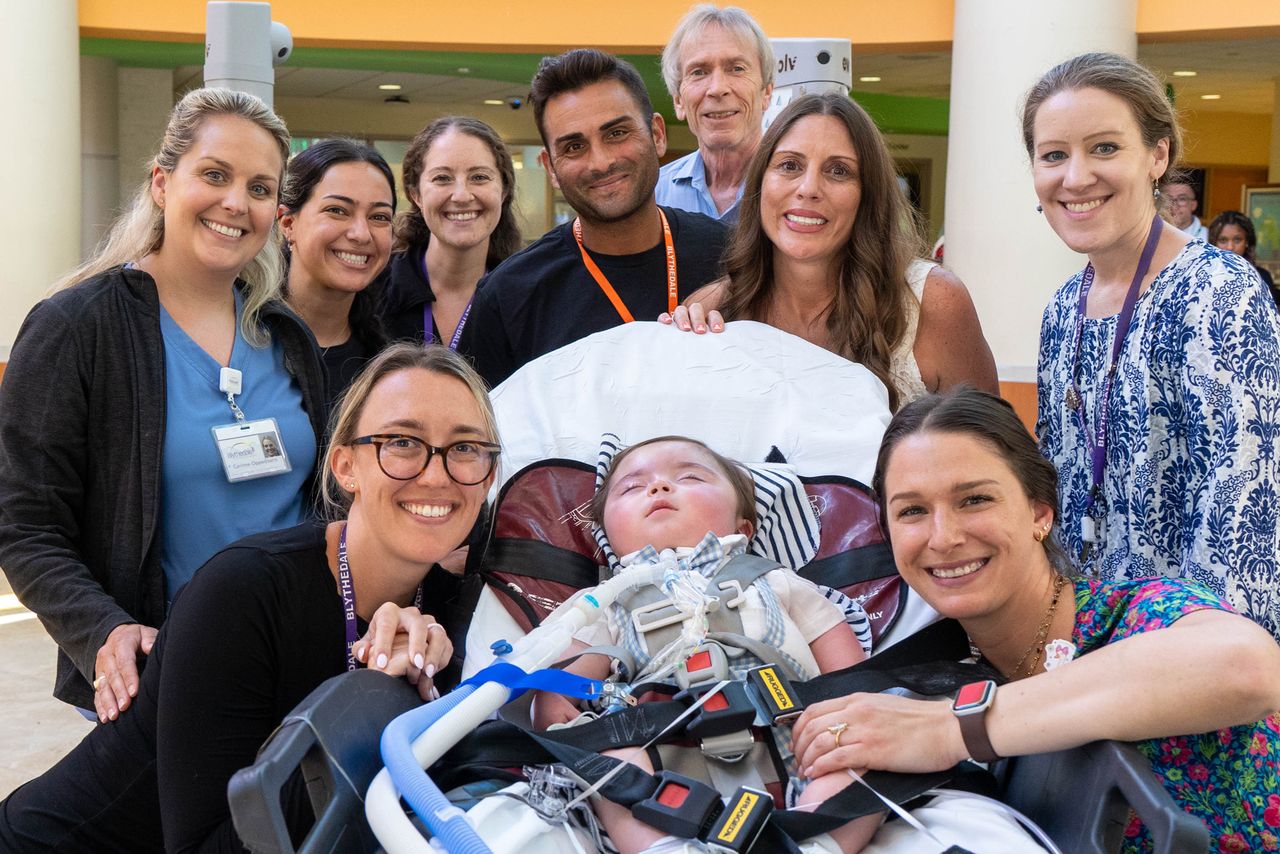 The Troianos with their son Anthony and the staff at Blythedale Children’s HospitalCredit: Jackie Rocco/Blythedale Children's Hospital