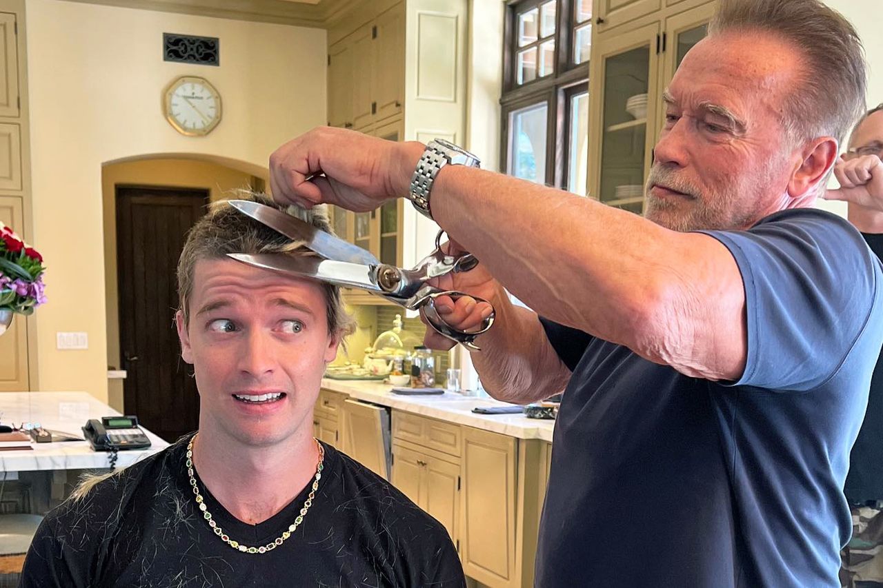 Arnold Schwarzenegger cuts his son Patrick's hair. Arnold Schwarzenegger cuts his son Patrick’s hair.Credit: Patrick Schwarzenegger/ Instagram