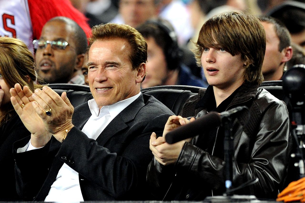 Governor of California Arnold Schwarzenegger and son Patrick Schwarzenegger in the audience during the NBA All-Star Game held at Cowboys Stadium on February 14, 2010 in Arlington, Texas. Arnold and Patrick Schwarzenegger in 2010Credit: Jason Merritt/Getty