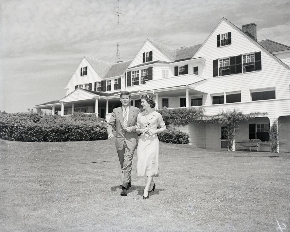 Senator John F. Kennedy and Miss Jacqueline Bouvier stroll across the lawn of his family’s home after announcing their engagement.Credit: Getty