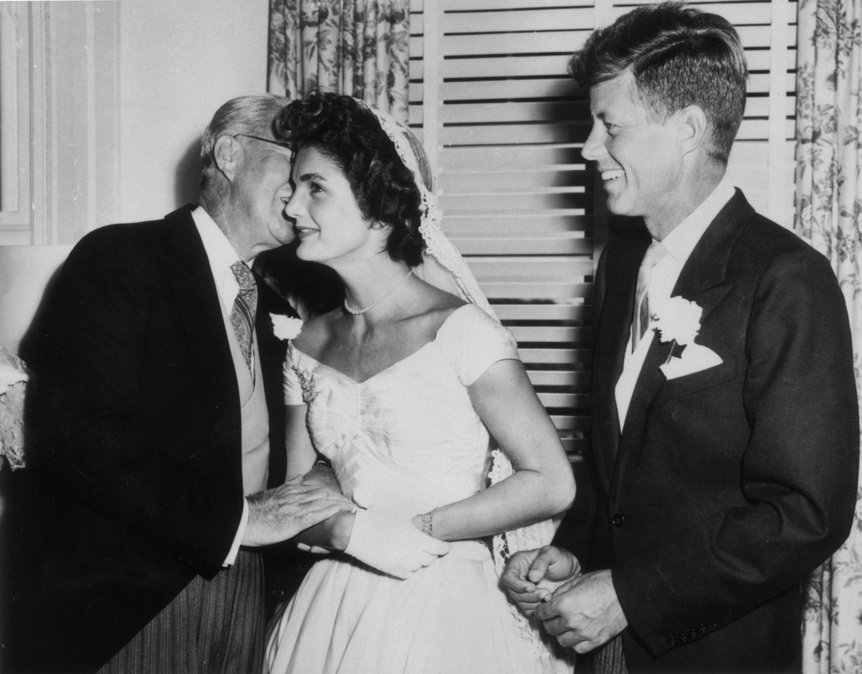 Joseph Kennedy, his new daughter-in-law Jacqueline Bouvier and her new husband John F. Kennedy on their wedding day on Sept. 12, 1953, in Newport, R.I.Credit: Getty