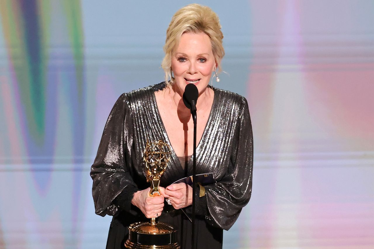 Jean Smart holding an Emmy Award on stage Credit: Kevin Winter/Getty