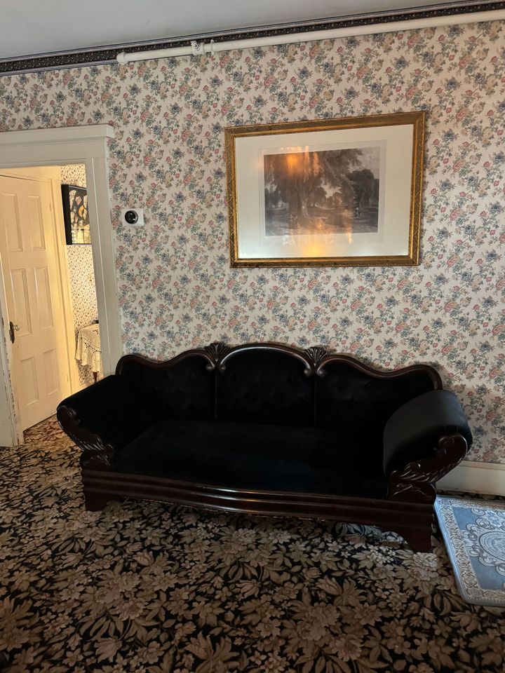 Lizzie Borden Andrew’s body was found on the couch in this parlor room.Credit: courtesy Ghost Moms