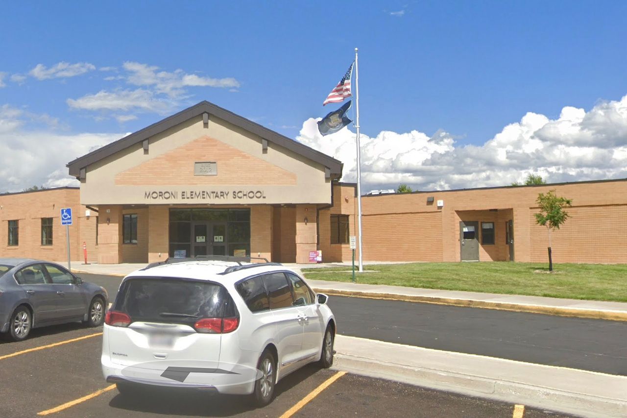 The building and entrance of Moroni Elementary School with a parked minivan in the foreground Moroni Elementary School in Moroni, UtahCredit: Google Maps