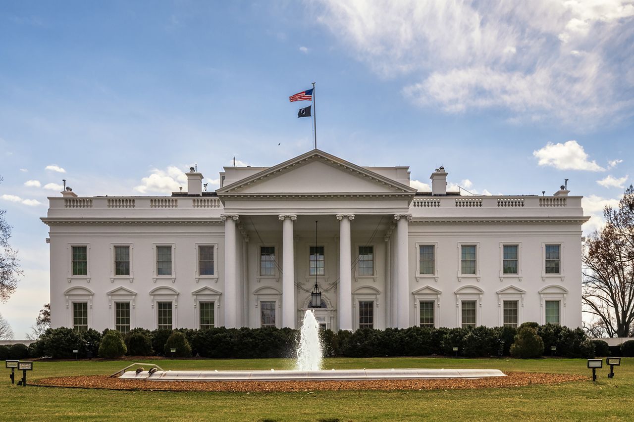 The White House North Portico with flags flying and a fountain in front A stock photo of the White HouseCredit: J. David Ake/Getty