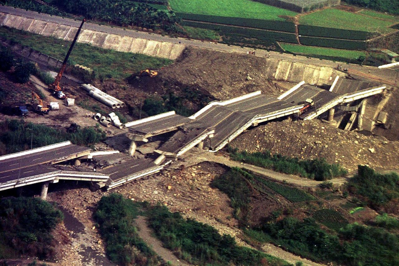 A destroyed bridge link between Minchien and Chushan lies in pieces on September 26, 1999 in Nantou County. A destroyed bridge link between Minchien and Chushan lies in pieces 26 September 1999 in Nantou CountyCredit: LIN HSIN-MING/AFP via Getty