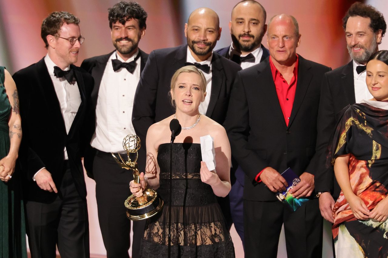 Katie Dippold speaking at an event with Matthew Rhys Colton Dunn Woody Harrelson and Hugo Conte standing nearby Credit: Chloe Kern/WireImage