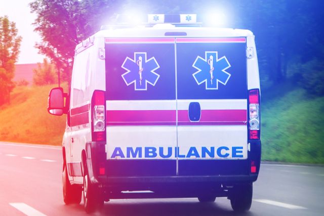 Ambulance van on highway with flashing lights A generic photo of an ambulance on a roadway.Credit: Getty