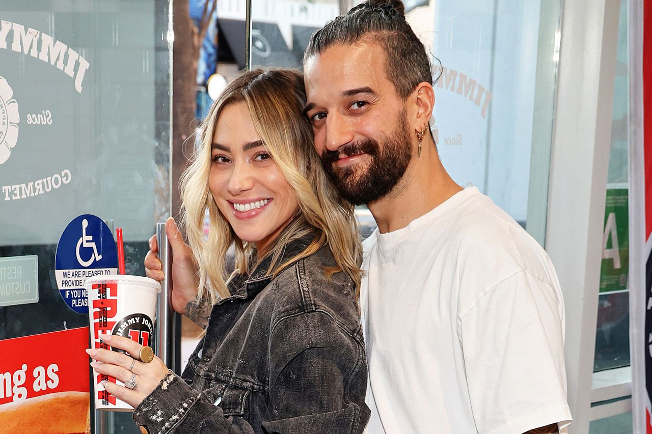 In this photo released on October 7, 2025, DWTS Pro Mark Ballas and wife BC Jean share a perfectly cheesy moment with a Jimmy Johnâs Toasted Pizza Sandwich ahead of tonight's episode in Los Angeles, California. Mark Ballas and BC Jean on October 7, 2025 in Los Angeles, CaliforniaCredit: Sara Jaye/Getty