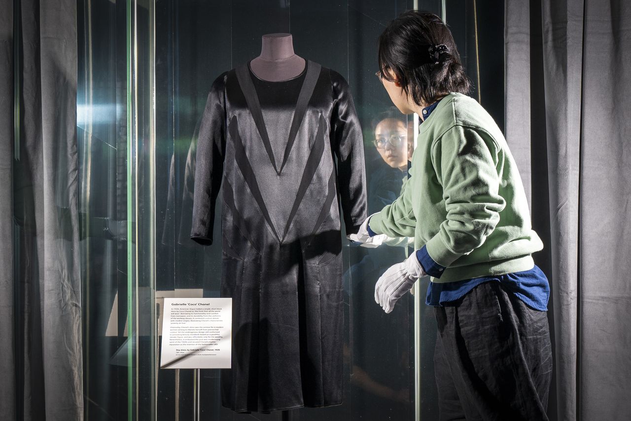 Textile Conservator Yufei Xiang at the National Museum of Scotland in Edinburgh, makes final adjustments to Coco Chanel's original 'Little Black Dress' (1926) prior to it going on show in the Beyond The Little Black Dress exhibition on 1 July. The new style, hailed by US Vogue at the time as Coco Chanel’s little black dress on display at the National Museum of Scotland in 2023.Credit: Jane Barlow/PA Images via Getty