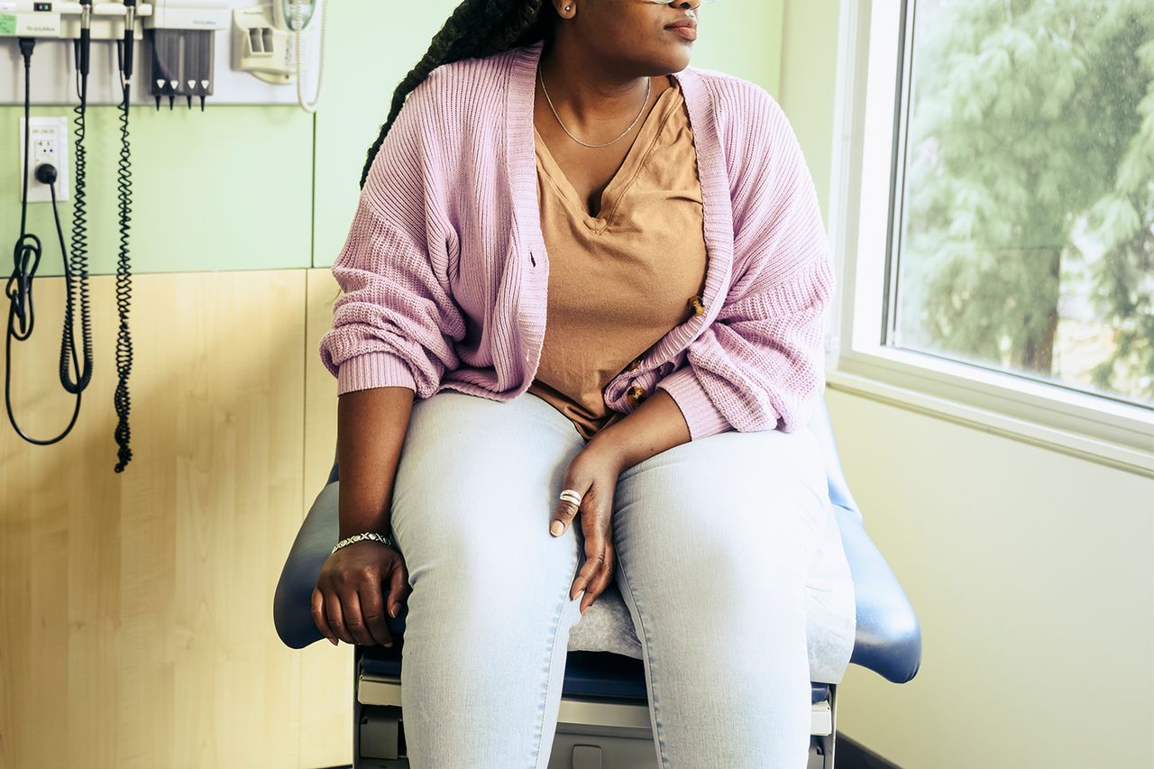 Female patient waiting in doctor's exam room - stock photo A woman in a hospital (stock image)Credit: The Good Brigade/Getty