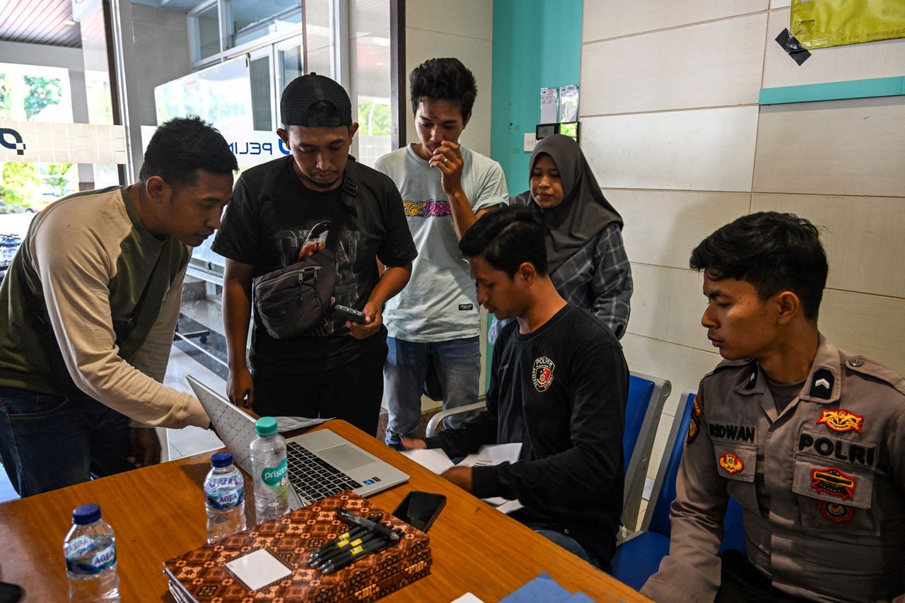 Relatives of affected passengers ask for information amid ongoing rescue operations on the stricken Virgo Transport 8 ferry, at Trisakti Bandarmasih Port in Banjarmasin, South Kalimantan, on September 13, 2026. Relatives of affected passengers on Sunday, Sept. 13Credit: JUNI KRISWANTO / AFP via Getty