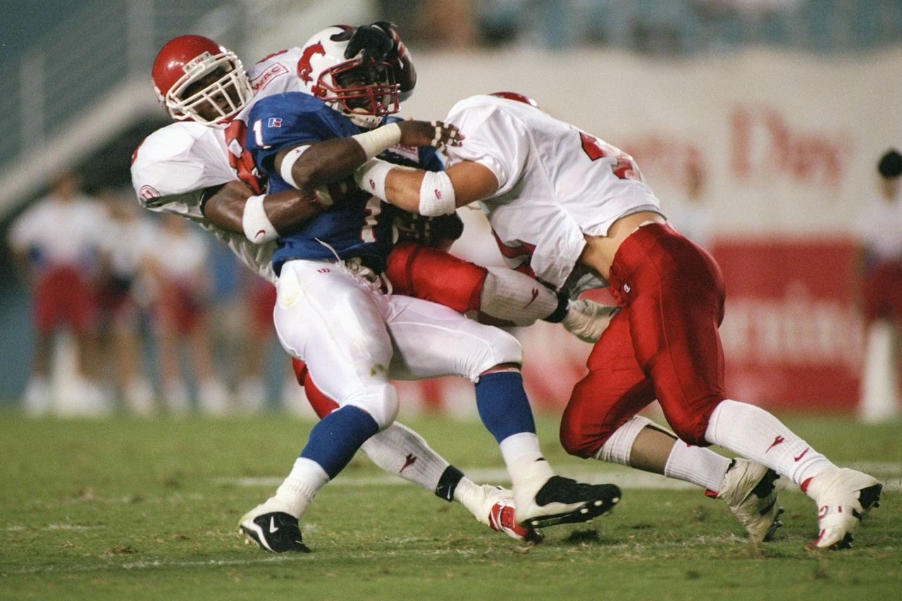 Brandon Dart (R) during a game at the Cotton Bowl in Dallas, TexasCredit: Brian Bahr/Allsport via Getty