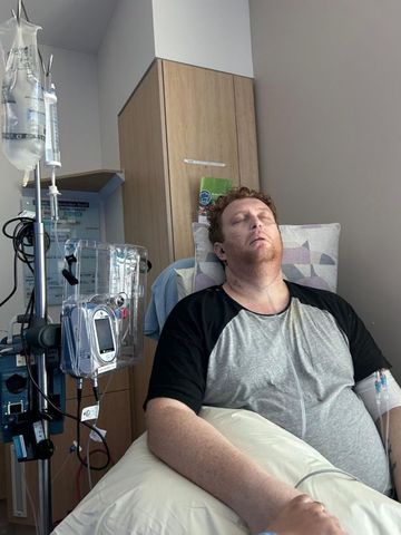 Luke Woodhouse recovering in hospital after open-heart surgeryCredit: Queensland Health/Facebook